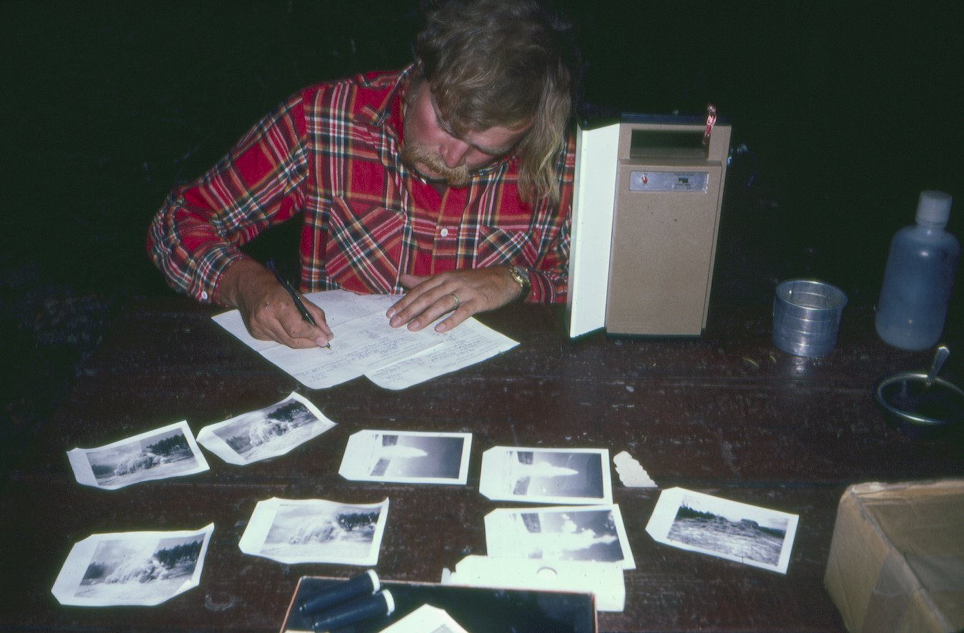 Gordy Bushaw filling out site data forms at camp in Yellowstone, Wyoming, 1978.